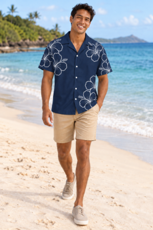 Younger adult male model wearing Digital Piko’s navy Hibiscus Aloalo aloha shirt with pale outlined hibiscus flowers.